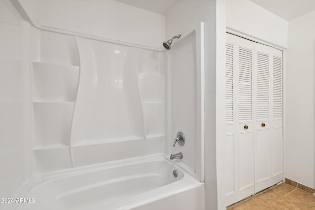 bathroom with tile patterned flooring and shower / bathtub combination