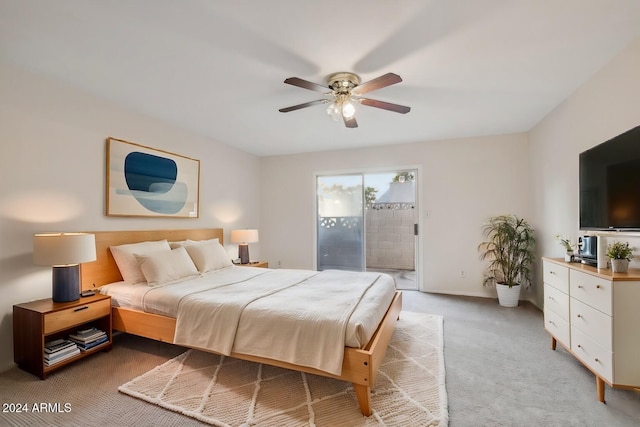 bedroom with light carpet, access to outside, and ceiling fan