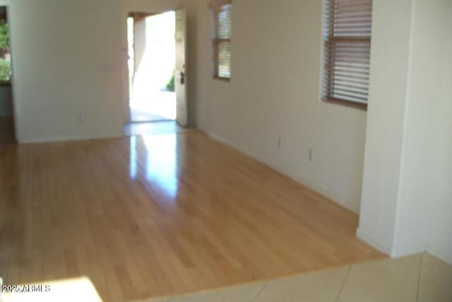 spare room featuring wood finished floors