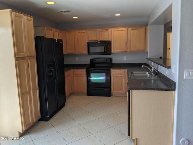 kitchen with light tile patterned floors, recessed lighting, a sink, black appliances, and dark countertops