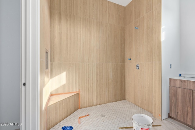 bathroom with a tile shower