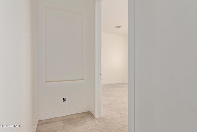 corridor with baseboards