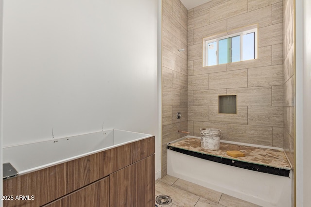 full bathroom featuring tiled shower