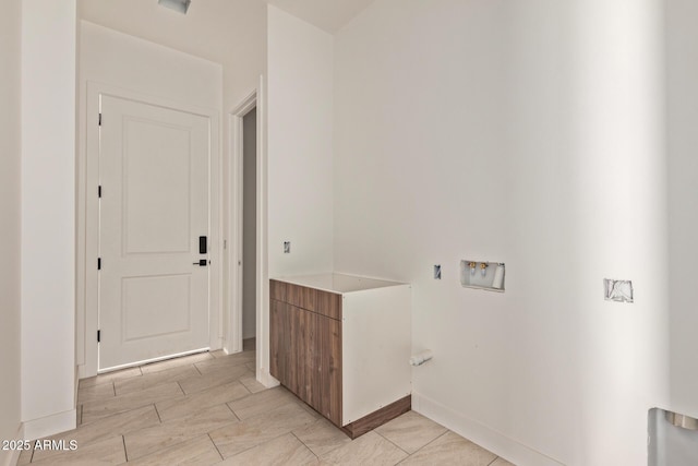 laundry room featuring washer hookup, laundry area, baseboards, and wood tiled floor