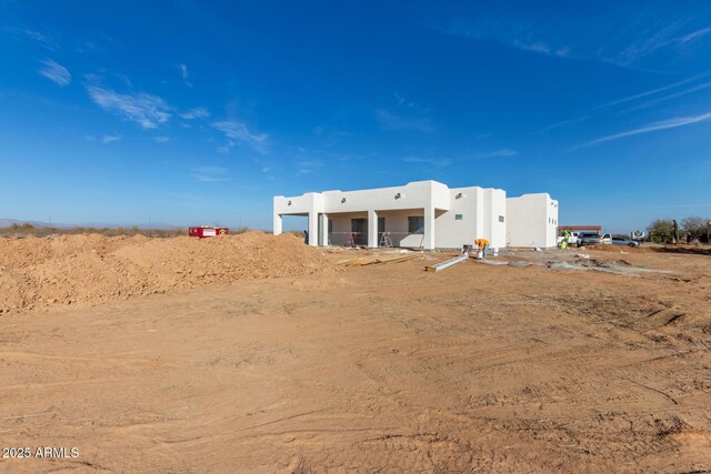 exterior space featuring stucco siding