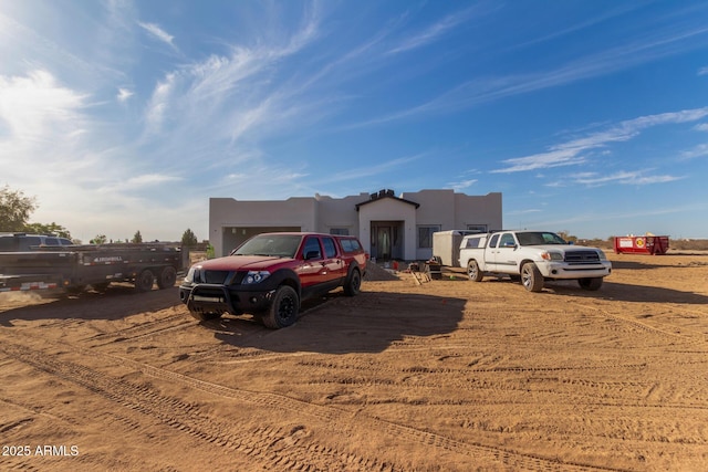 pueblo-style home with stucco siding