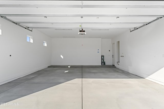 garage featuring baseboards and a garage door opener