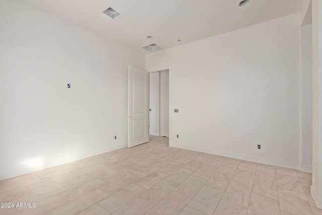 empty room with baseboards