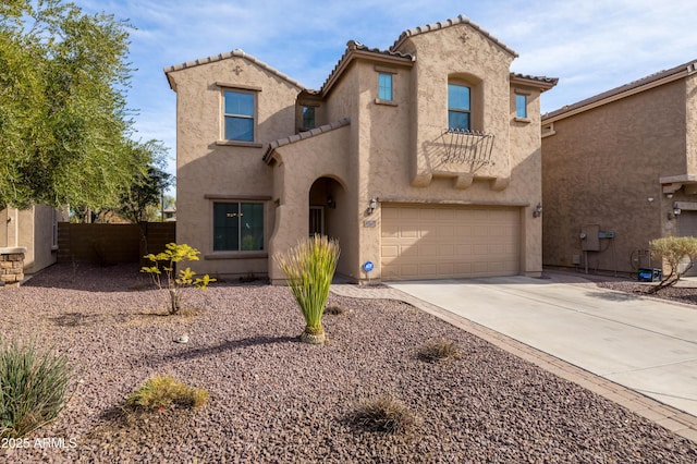 mediterranean / spanish-style home with a garage