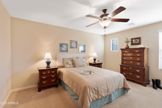 bedroom with light colored carpet and ceiling fan