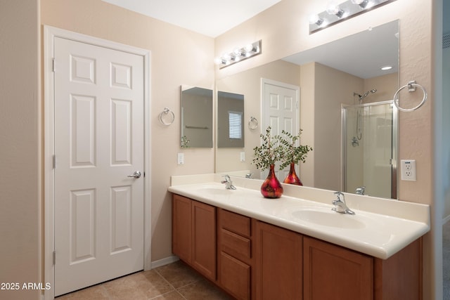 bathroom featuring vanity, tile patterned flooring, and walk in shower