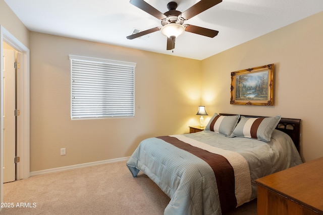 bedroom featuring light carpet and ceiling fan