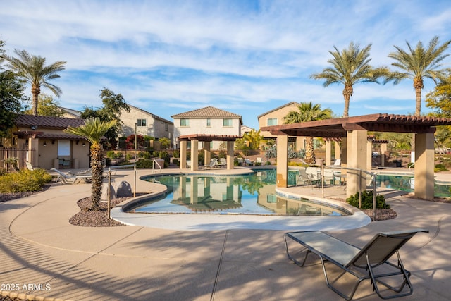 view of pool featuring a pergola and a patio