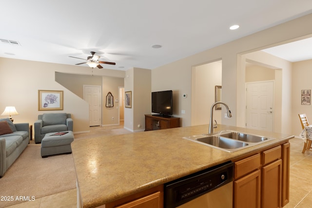 kitchen with ceiling fan, stainless steel dishwasher, and sink