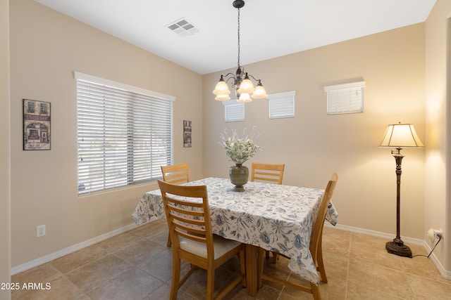 dining room featuring a chandelier