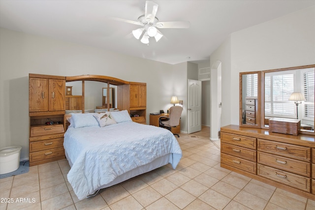 tiled bedroom with ceiling fan