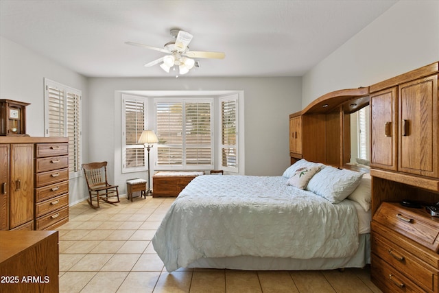 tiled bedroom with ceiling fan