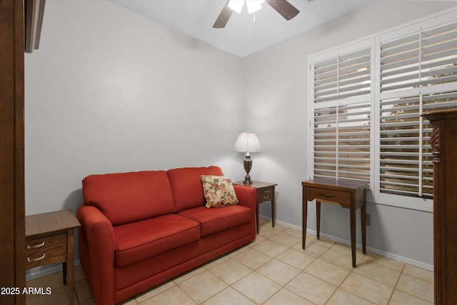 tiled living room featuring ceiling fan