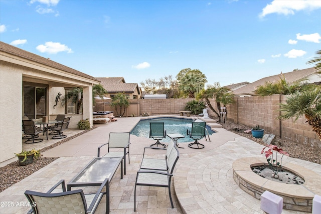 view of swimming pool featuring an outdoor fire pit and a patio area