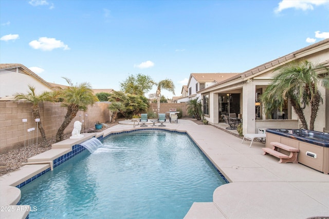 view of pool featuring a hot tub, a patio, and pool water feature