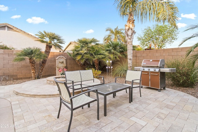 view of patio with grilling area and an outdoor living space