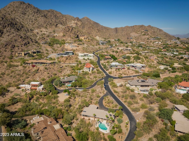 birds eye view of property with a mountain view