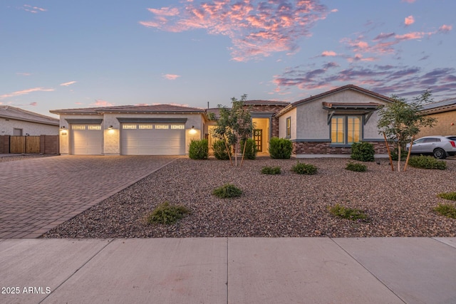 3814 W Running Deer Trl, Phoenix, AZ 85083 - view of front of home with decorative driveway, stucco siding, and an attached garage