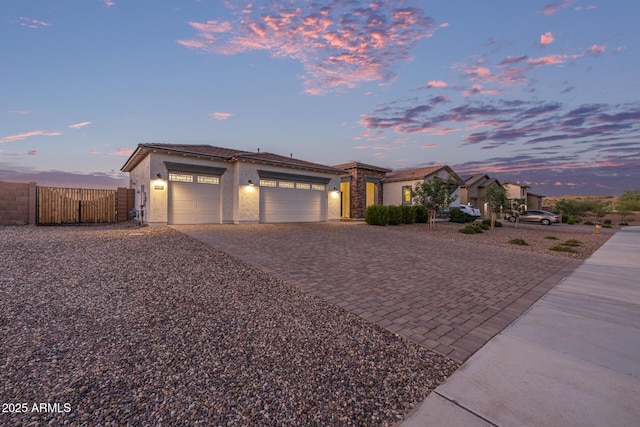3814 W Running Deer Trl, Phoenix, AZ 85083 - view of front of property featuring decorative driveway, a garage, a gate, and stucco siding