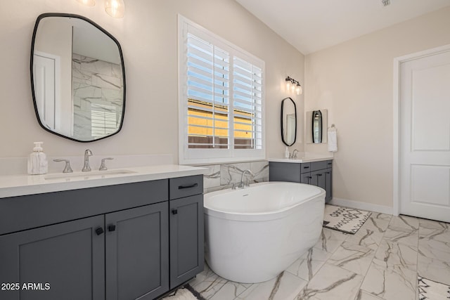 3814 W Running Deer Trl, Phoenix, AZ 85083 - bathroom with two vanities, marble finish flooring, and a freestanding tub
