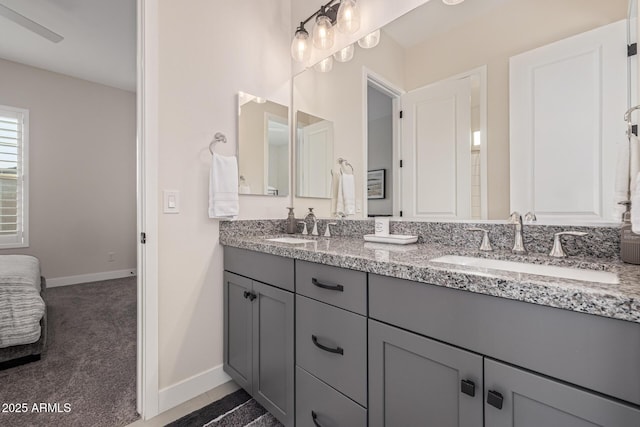 3814 W Running Deer Trl, Phoenix, AZ 85083 - full bathroom with double vanity and baseboards