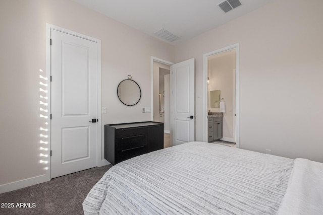 3814 W Running Deer Trl, Phoenix, AZ 85083 - bedroom with dark carpet and ensuite bathroom