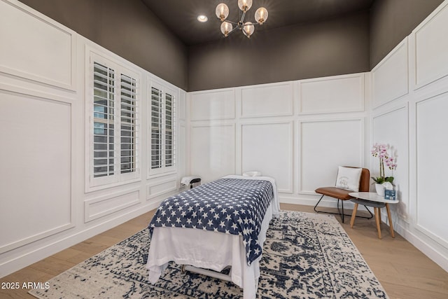 3814 W Running Deer Trl, Phoenix, AZ 85083 - bedroom featuring a decorative wall, recessed lighting, a chandelier, and light wood-style flooring
