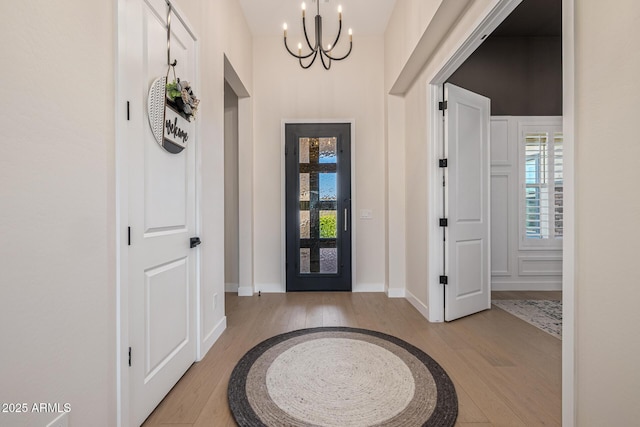 3814 W Running Deer Trl, Phoenix, AZ 85083 - foyer entrance featuring light wood finished floors and a chandelier