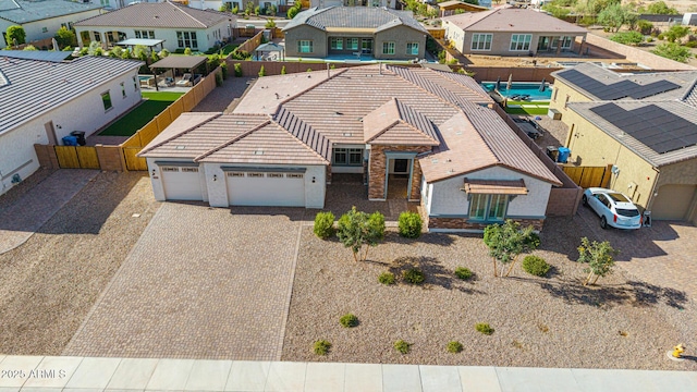 3814 W Running Deer Trl, Phoenix, AZ 85083 - view of front facade with a residential view, an attached garage, decorative driveway, a tile roof, and stucco siding