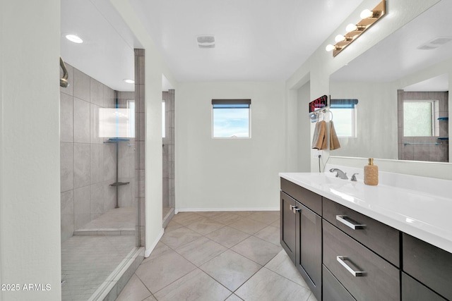 19026 W Becker Ln, Surprise, AZ 85388 - full bathroom featuring walk in shower, baseboards, vanity, and tile patterned floors