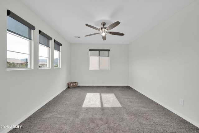 19026 W Becker Ln, Surprise, AZ 85388 - empty room featuring carpet, a ceiling fan, and baseboards