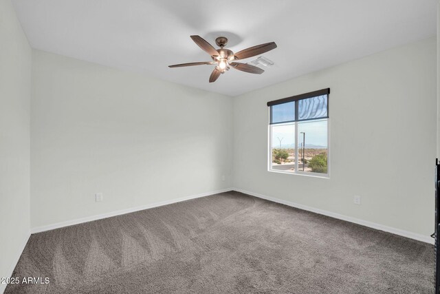 19026 W Becker Ln, Surprise, AZ 85388 - empty room featuring carpet flooring, a ceiling fan, and baseboards