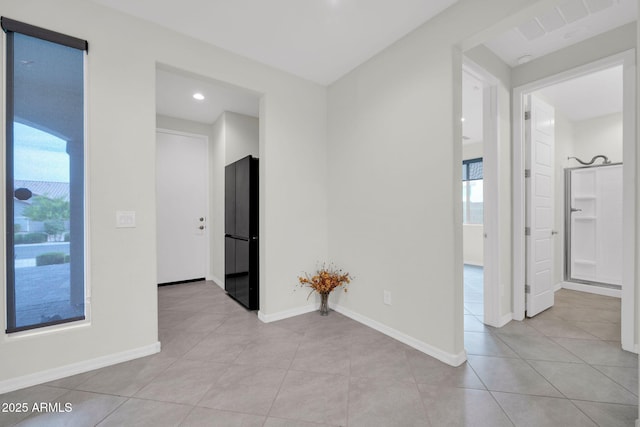 19026 W Becker Ln, Surprise, AZ 85388 - spare room with plenty of natural light, light tile patterned floors, baseboards, and recessed lighting