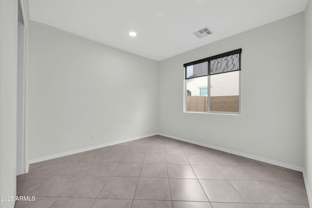19026 W Becker Ln, Surprise, AZ 85388 - unfurnished room with tile patterned floors, baseboards, and recessed lighting