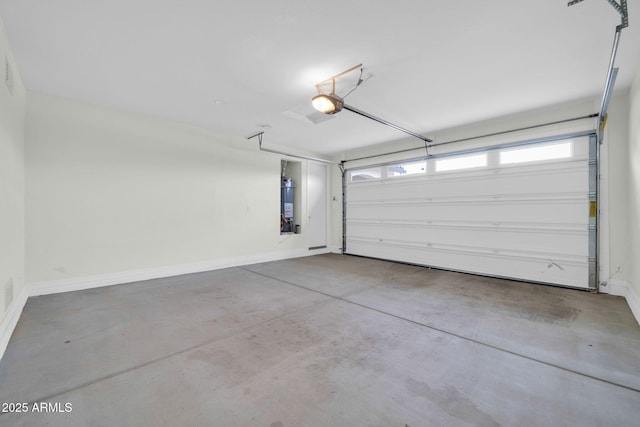 19026 W Becker Ln, Surprise, AZ 85388 - garage with water heater, a garage door opener, and baseboards