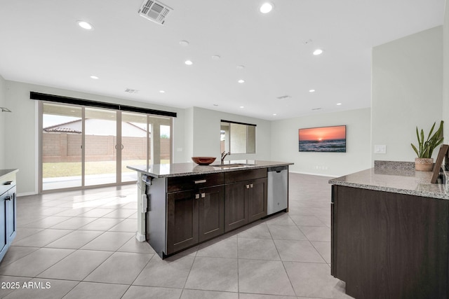 19026 W Becker Ln, Surprise, AZ 85388 - kitchen featuring stainless steel dishwasher, a sink, light stone counters, light tile patterned flooring, and recessed lighting