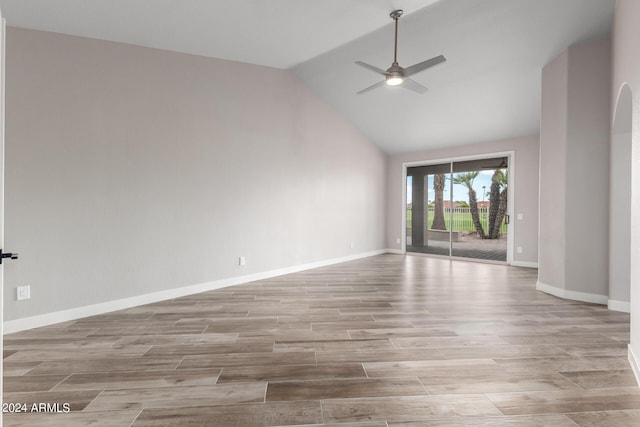 unfurnished room with ceiling fan and lofted ceiling