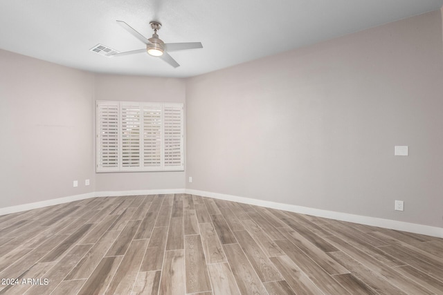 unfurnished room with ceiling fan and light hardwood / wood-style floors