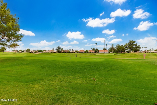 view of home's community featuring a lawn