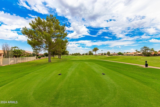 view of property's community featuring a yard