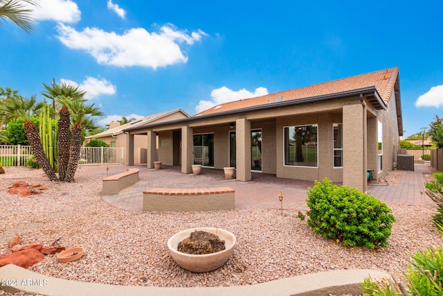 back of house featuring a patio area and central AC