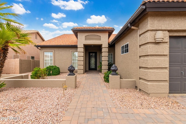 doorway to property featuring a garage