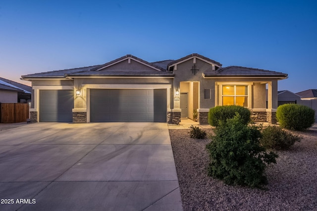 9454 E Alfalfa Dr, Florence, AZ 85132 - ranch-style house featuring stone siding, an attached garage, driveway, and stucco siding
