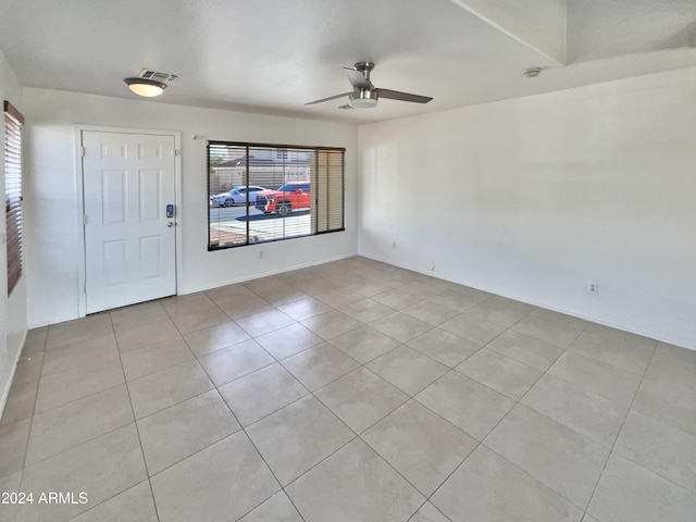 foyer with light tile patterned flooring and ceiling fan