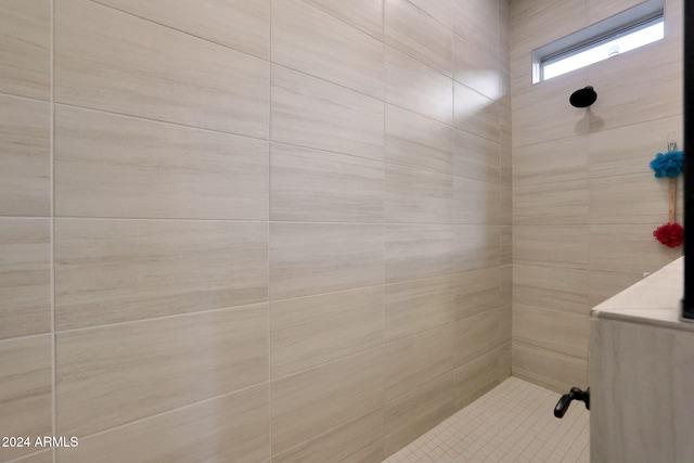 bathroom with a tile shower